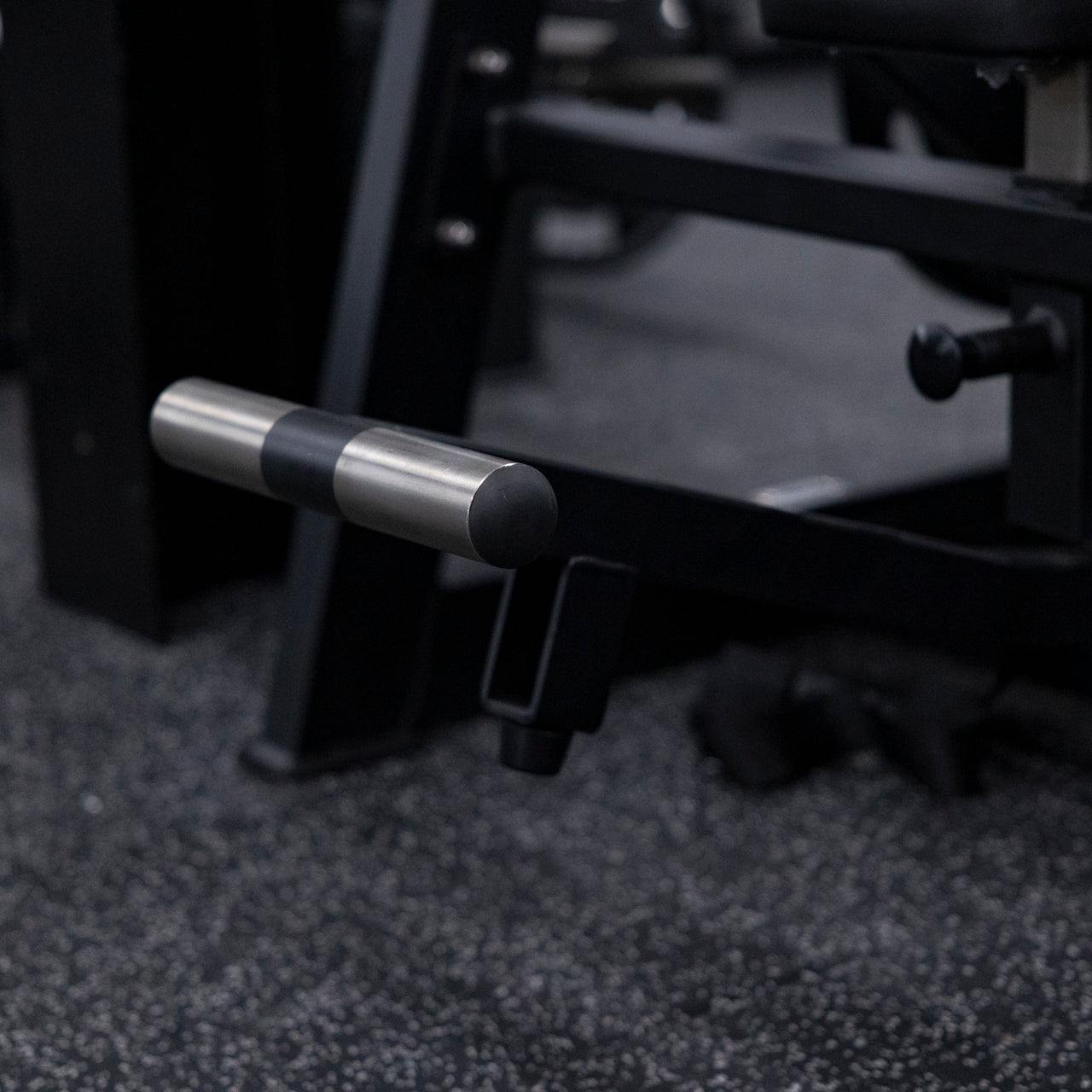 Close up view of steel footplate on plate-loaded pullover machine.