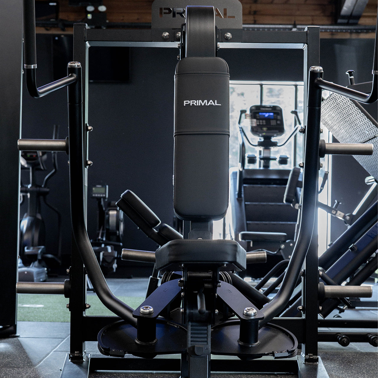 A plate loaded pec fly machine in a gym.