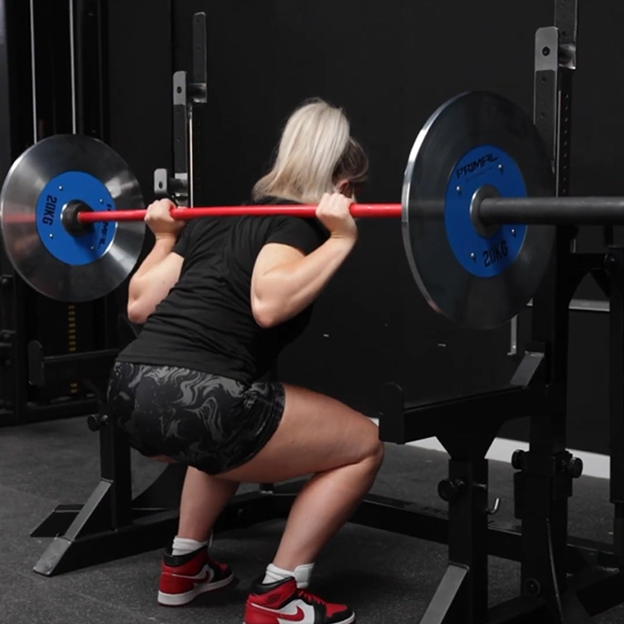 An athlete performing a squat.