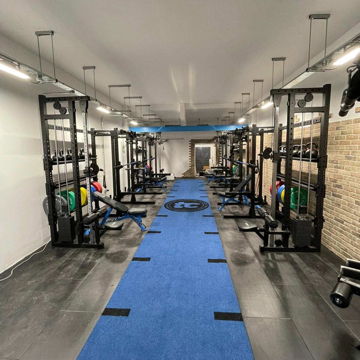 a custom blue gym astroturf track in a gym