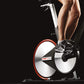 a woman using the pedals on a spin bike