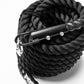 A carabiner attached to a black sled pull rope.
