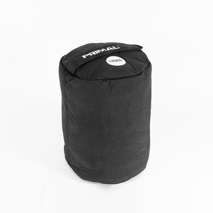 A 125kg black sandbag with handle for strongman workouts.