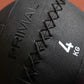 Close-up of a black wall ball with 'Primal' branding and weight marking.