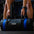 Person holding a 20kg Primal sand bag in a gym setting.