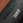 Black sandbag with 'PRIMAL' branding and '30KG' marking on a brown background in a gym.