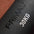 Black sandbag with 'PRIMAL' branding and '30KG' marking on a brown background in a gym.