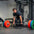 An athlete performing a deadlift using a loaded deadlift barbell.