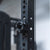 A magnetic lockjaw collar stuck to a steel gym rack frame.