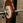 A powerlifting barbell loaded with calibrated plates, complete with a competition-grade collar.
