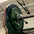 A powerlifting barbell loaded with calibrated plates, complete with a competition-grade collar.