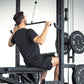 An athlete doing a lat pulldown on a half rack.