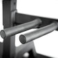 A close up of a dip handle attachment on a half rack.
