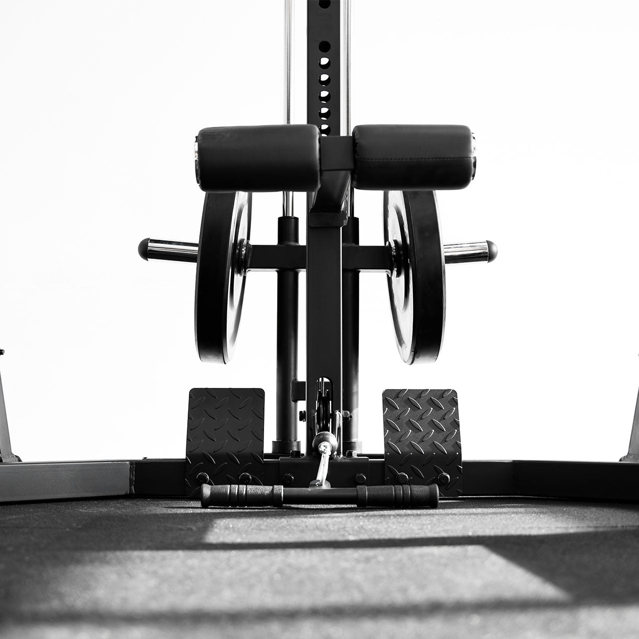 A pulley attachment used for low row exercises on a half rack.