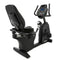 An indoor recumbent exercise bike.
