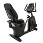 An indoor recumbent exercise bike.