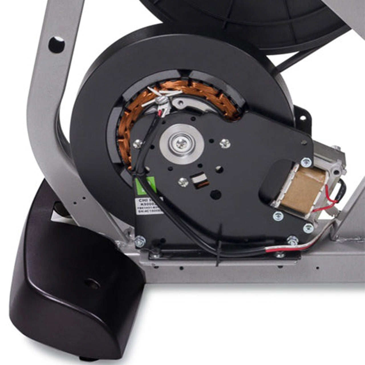 A close up of the generator for an indoor recumbent bike.