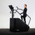 An athlete using a Primal exercise stepper machine in a studio.