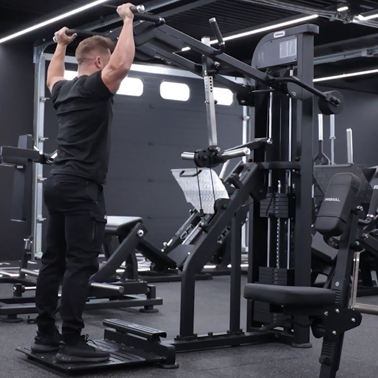 An athlete performing a viking press.