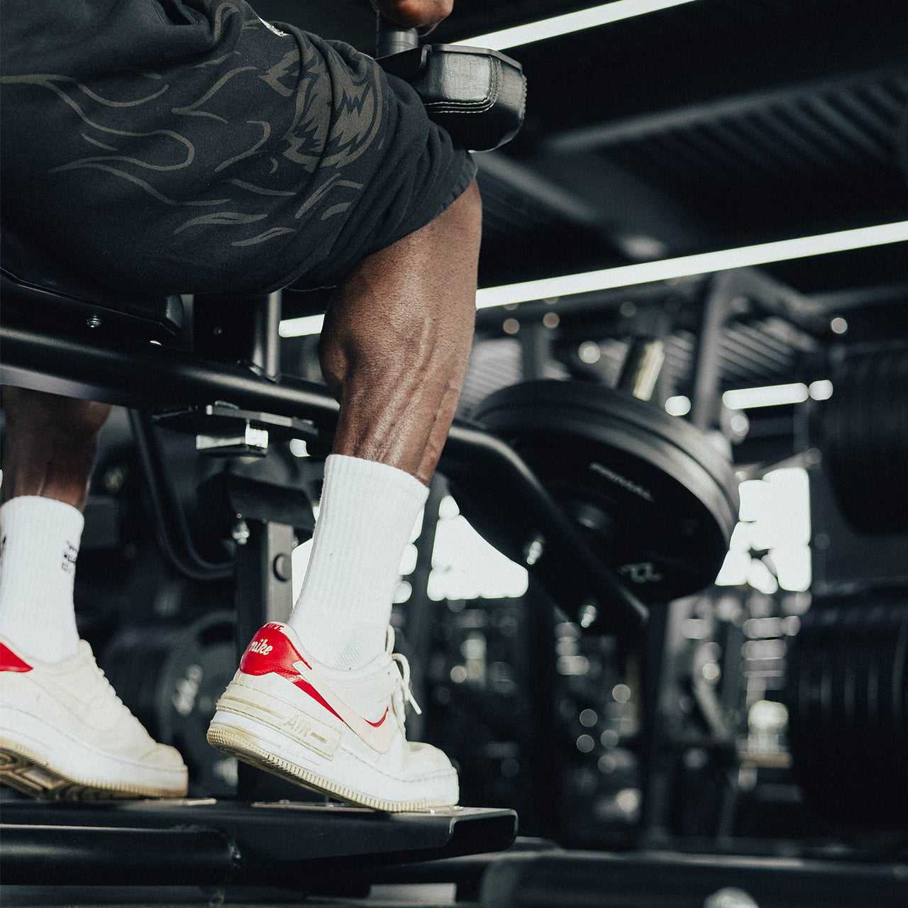 An athlete performing a calf raise movement.