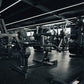 A plate loaded seated calf raise machine in a gym.
