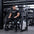 Angled view of athlete using plate-loaded pullover machine.