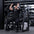 Angled view of athlete using plate-loaded pullover machine.
