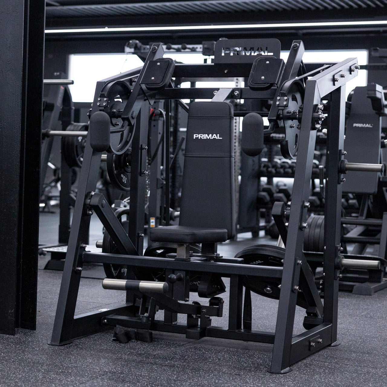 Angled view of plate-loaded pullover machine in gym setting.