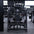 Straight on view of plate-loaded pullover machine in gym.