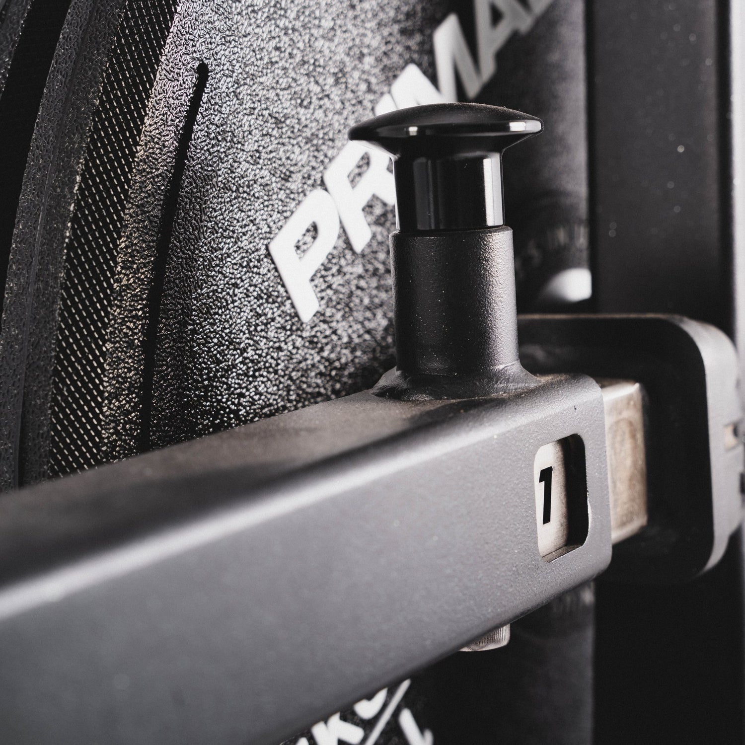 A pop pin for angle adjustment on a plate loaded rear kickback machine