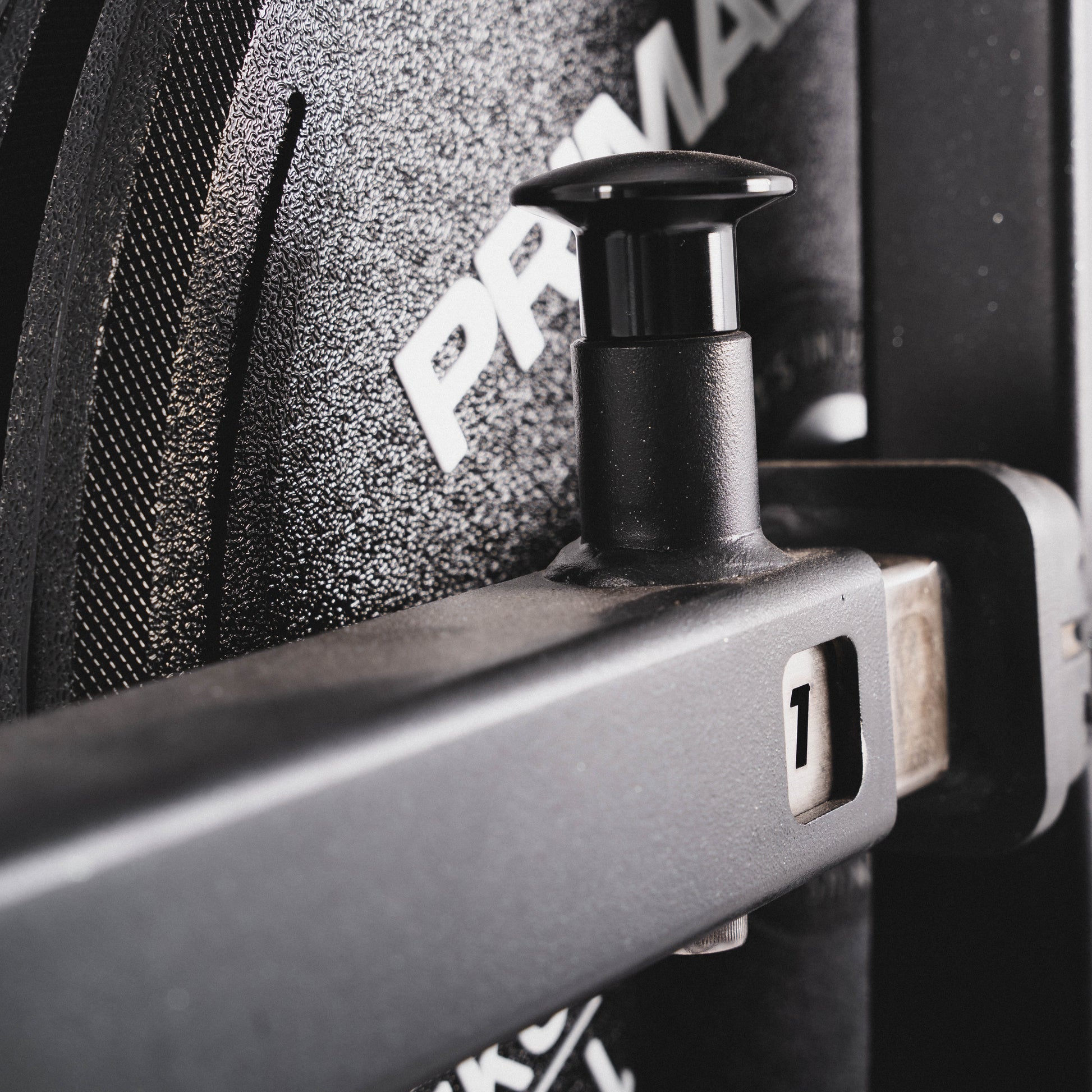 A pop pin for angle adjustment on a plate loaded rear kickback machine
