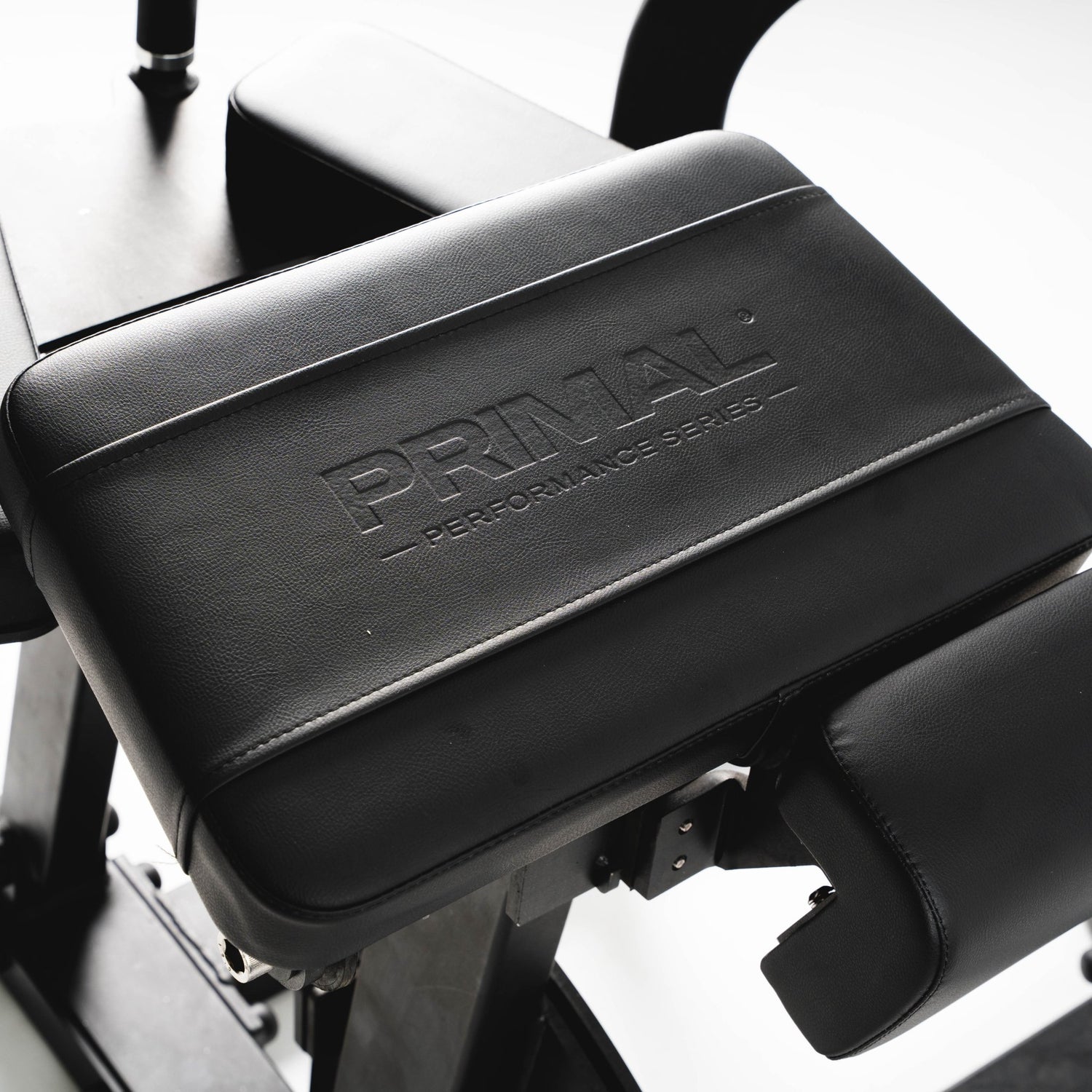 Black plate loaded machine with 'Primal Performance Series' branding on a white background