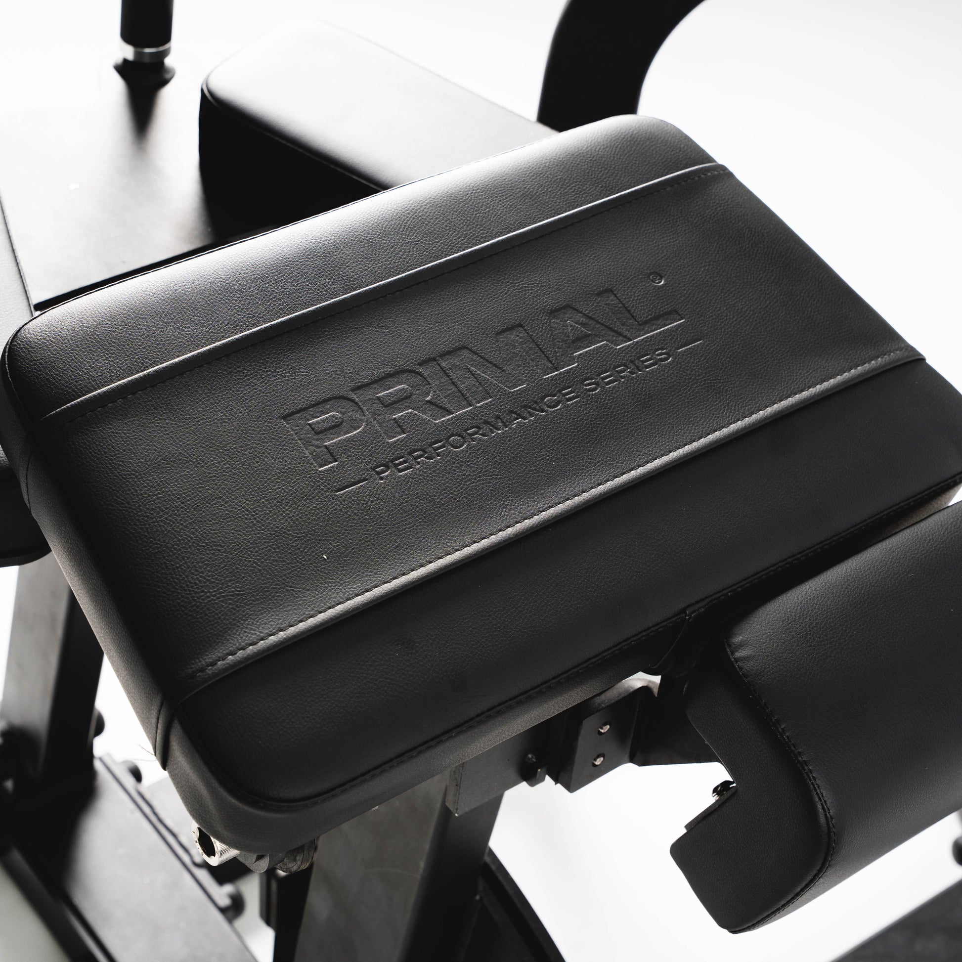 Black plate loaded machine with 'Primal Performance Series' branding on a white background