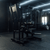 Angled view of plate-loaded standing hip thrust machine in gym.