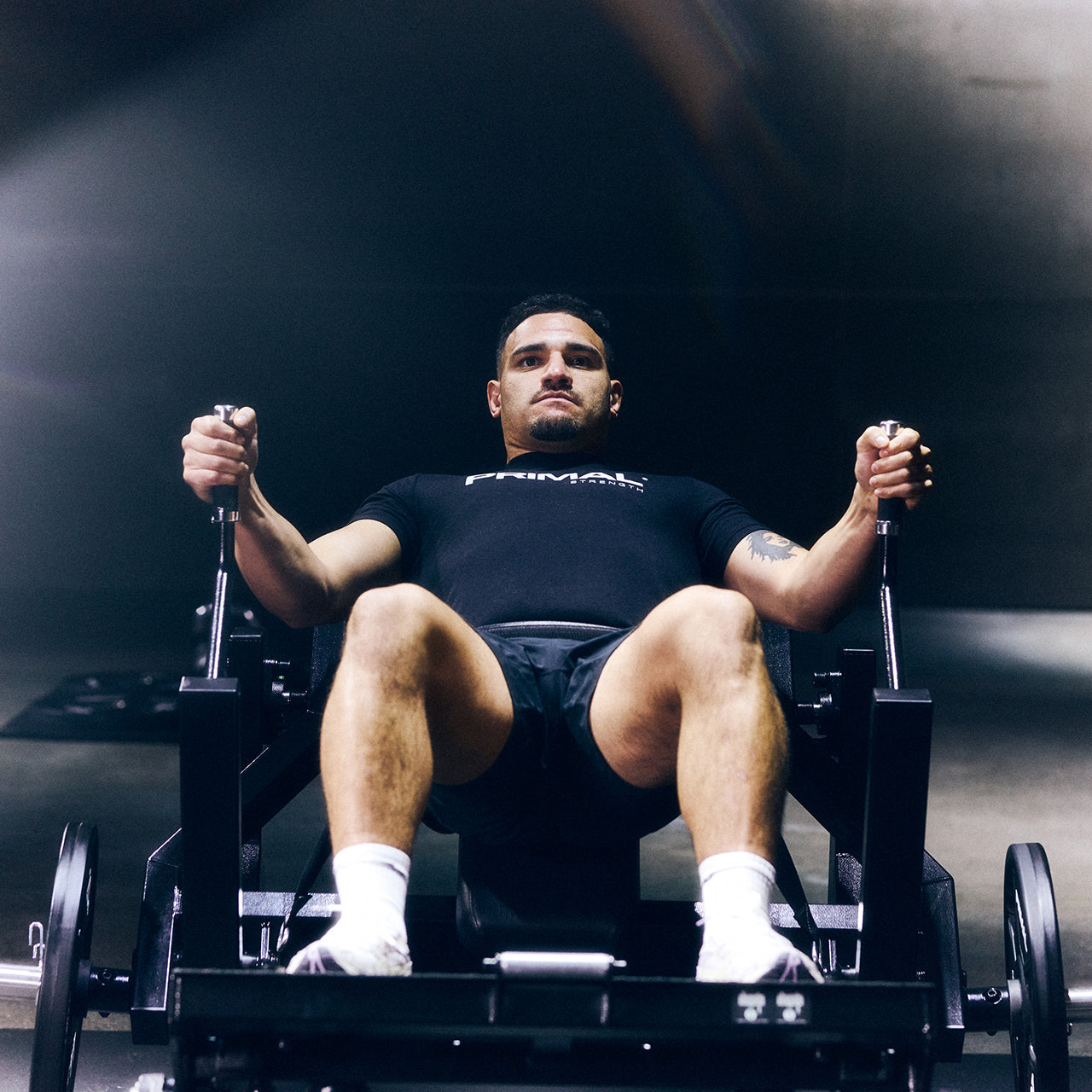 The Scotland rugby captain exercising on a glute drive/hip thrust machine in a gym.