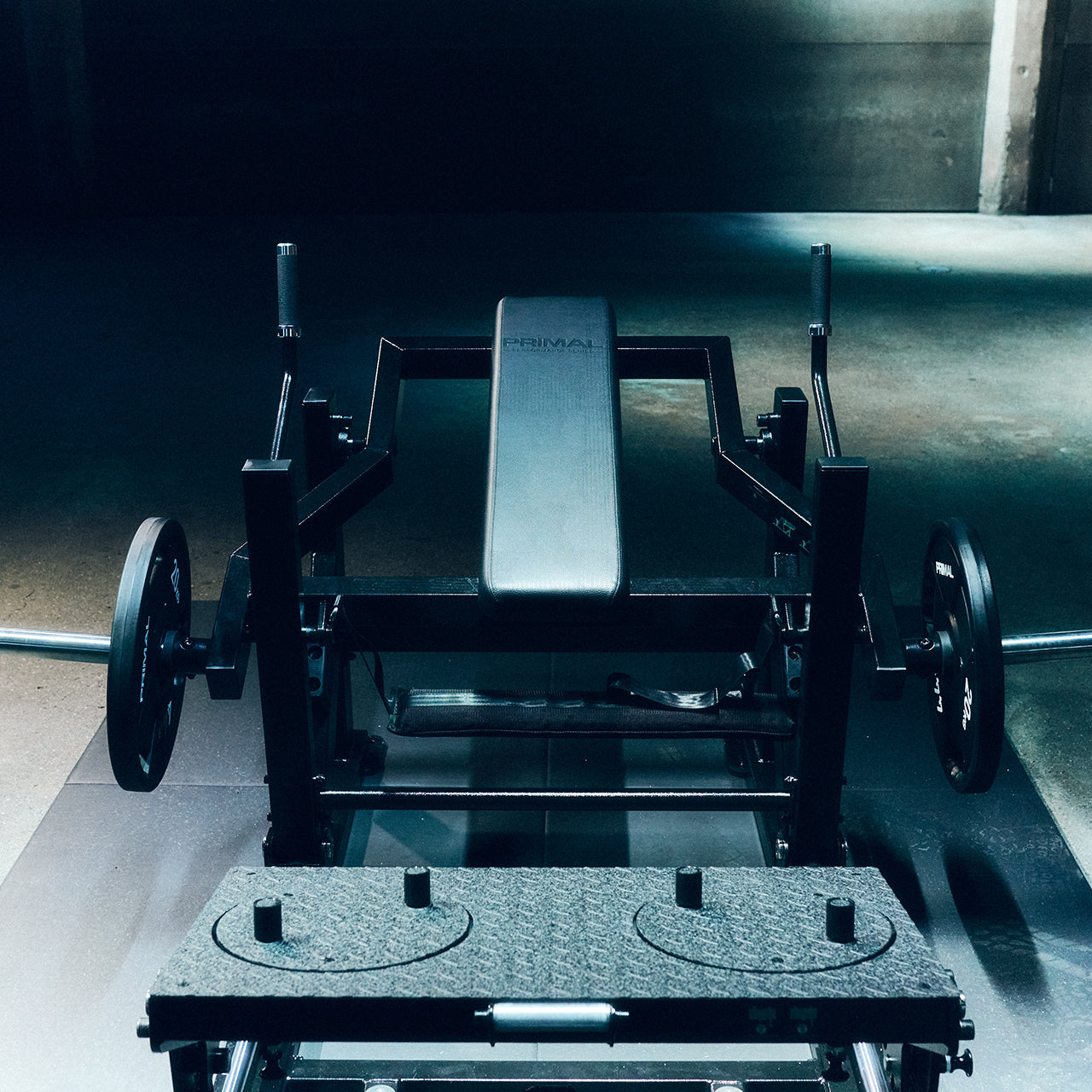 A front on image of a glute drive/hip thrust machine in a gym.