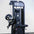 Black pin loaded bicep curl machine on a white background.