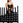 An athlete storing urethane studio dumbbells on a storage rack.
