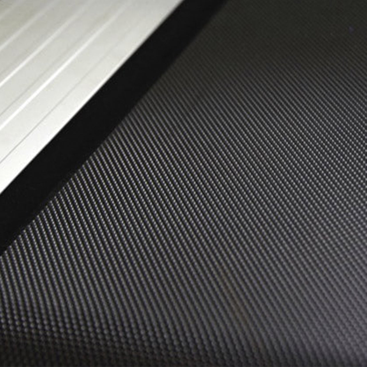 The running belt on a commercial-grade treadmill.