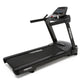 A treadmill cardio machine with console.