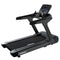 Black treadmill with digital console on a white background, branded 'Primal'.