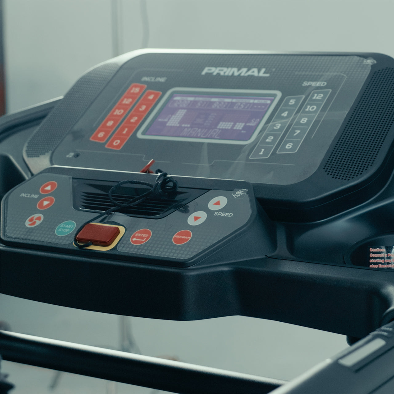 Close-up of a treadmill control panel with 'Primal' branding.