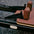Brown seat with black straps on a pilates reformer machine, featuring the brand 'Primal'.