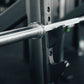A barbell resting on a j-hook.