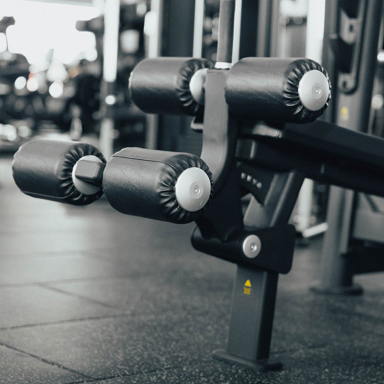 Leg pads on an Olympic decline weight bench.