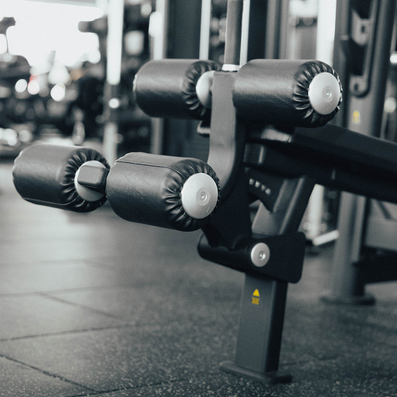 Leg pads on an Olympic decline weight bench.
