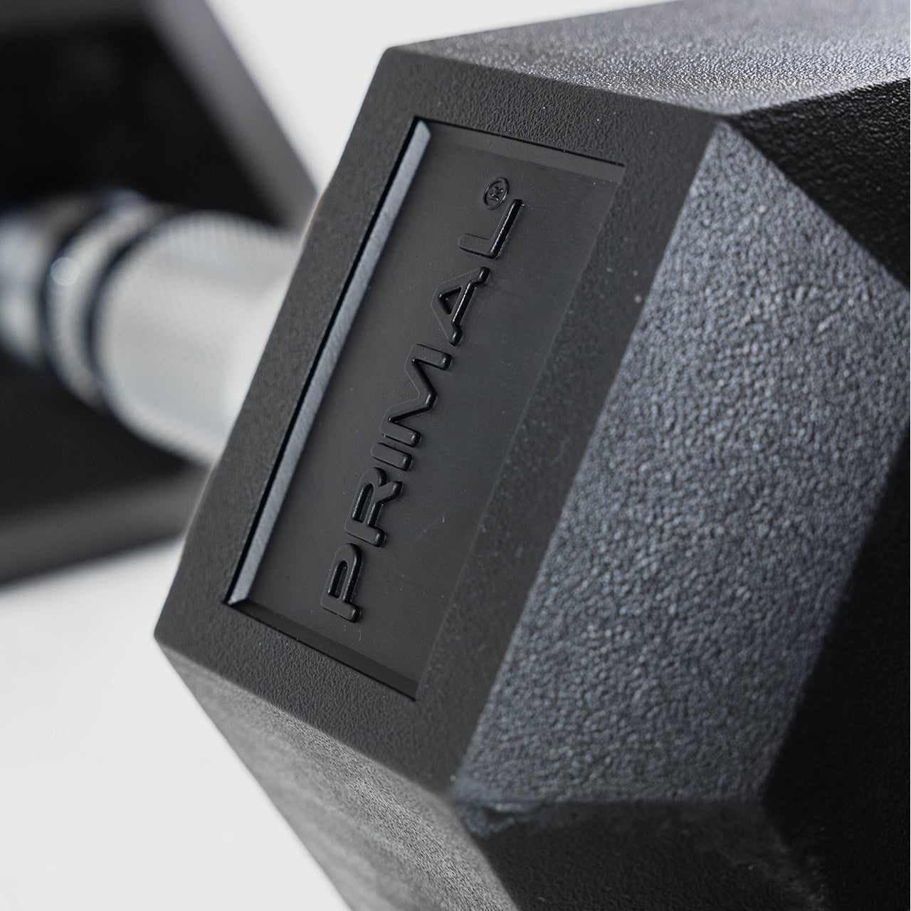 A close up of the branding on a hex dumbbell.