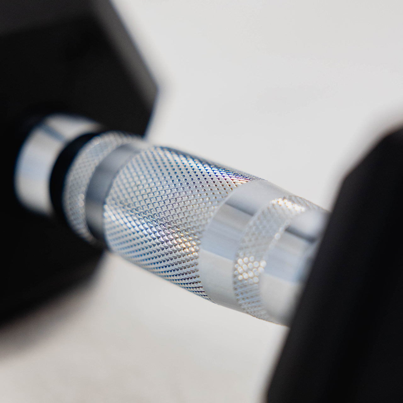 A close up of the grip handle on a hex dumbbell.