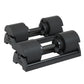 A pair of black 40kg adjustable dumbbells in storage cases.