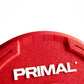Red urethane bumper plate with Primal branding and contoured grip handle
